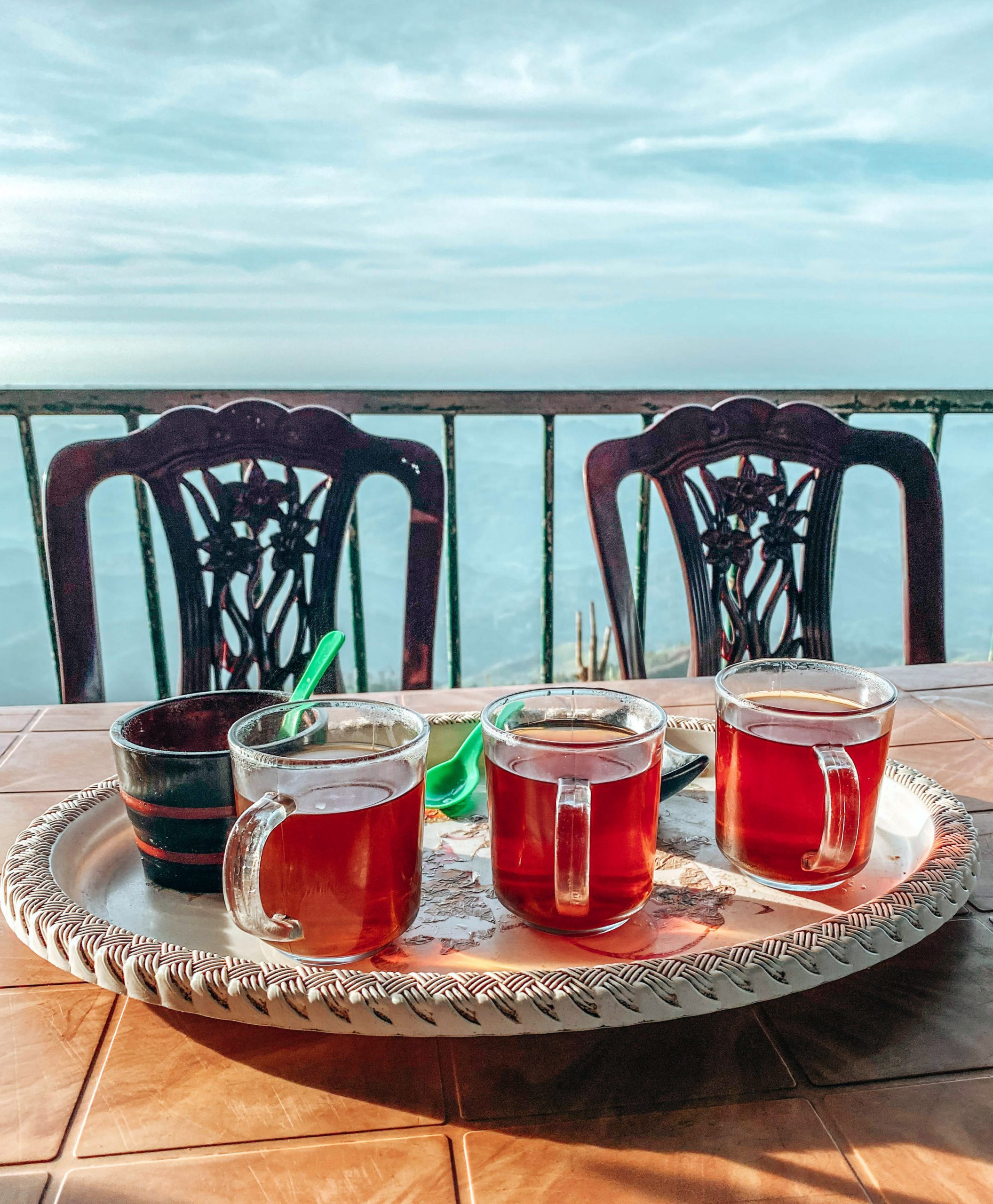 Tray with four cups of tea