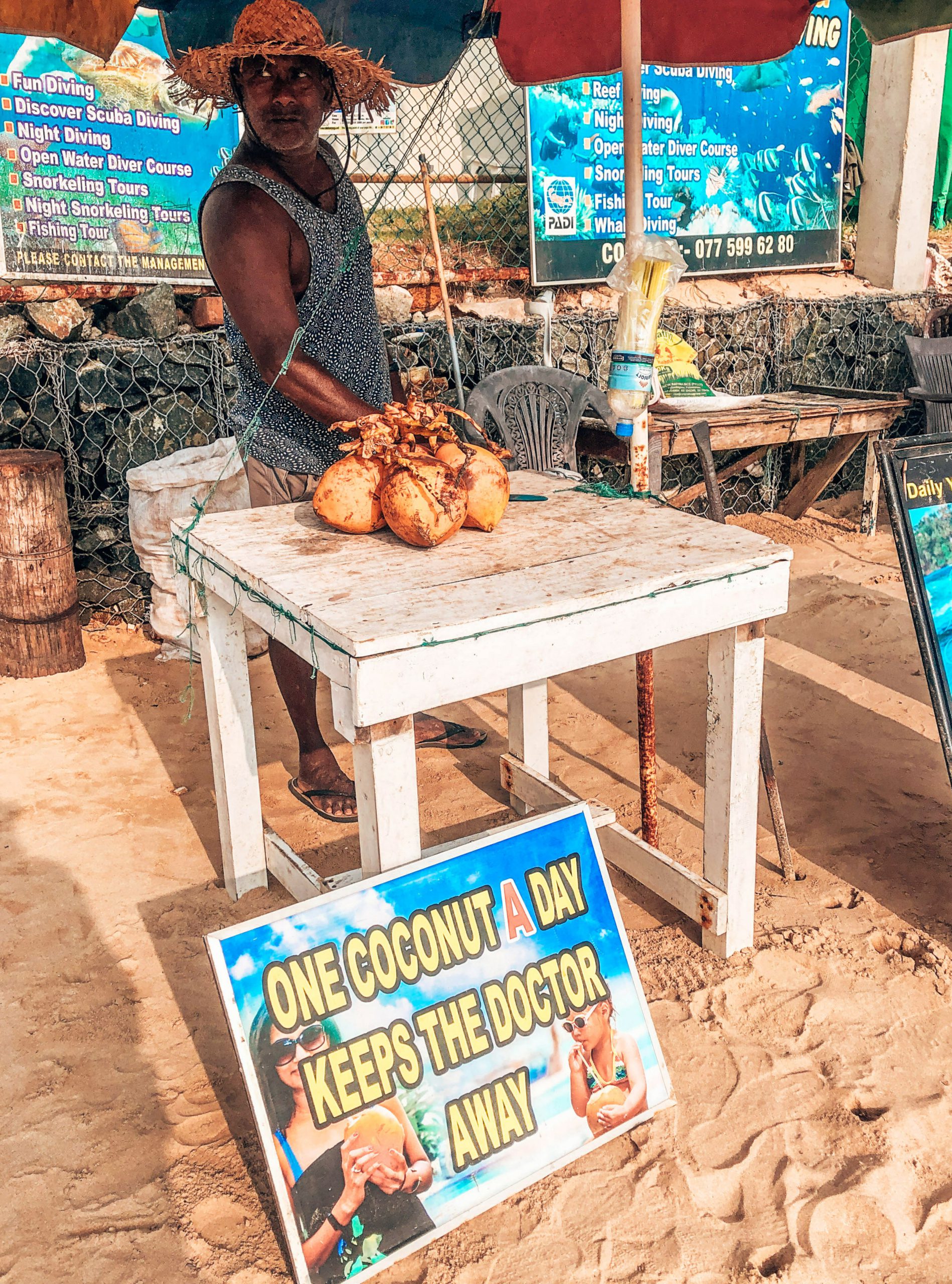 man selling coconuts