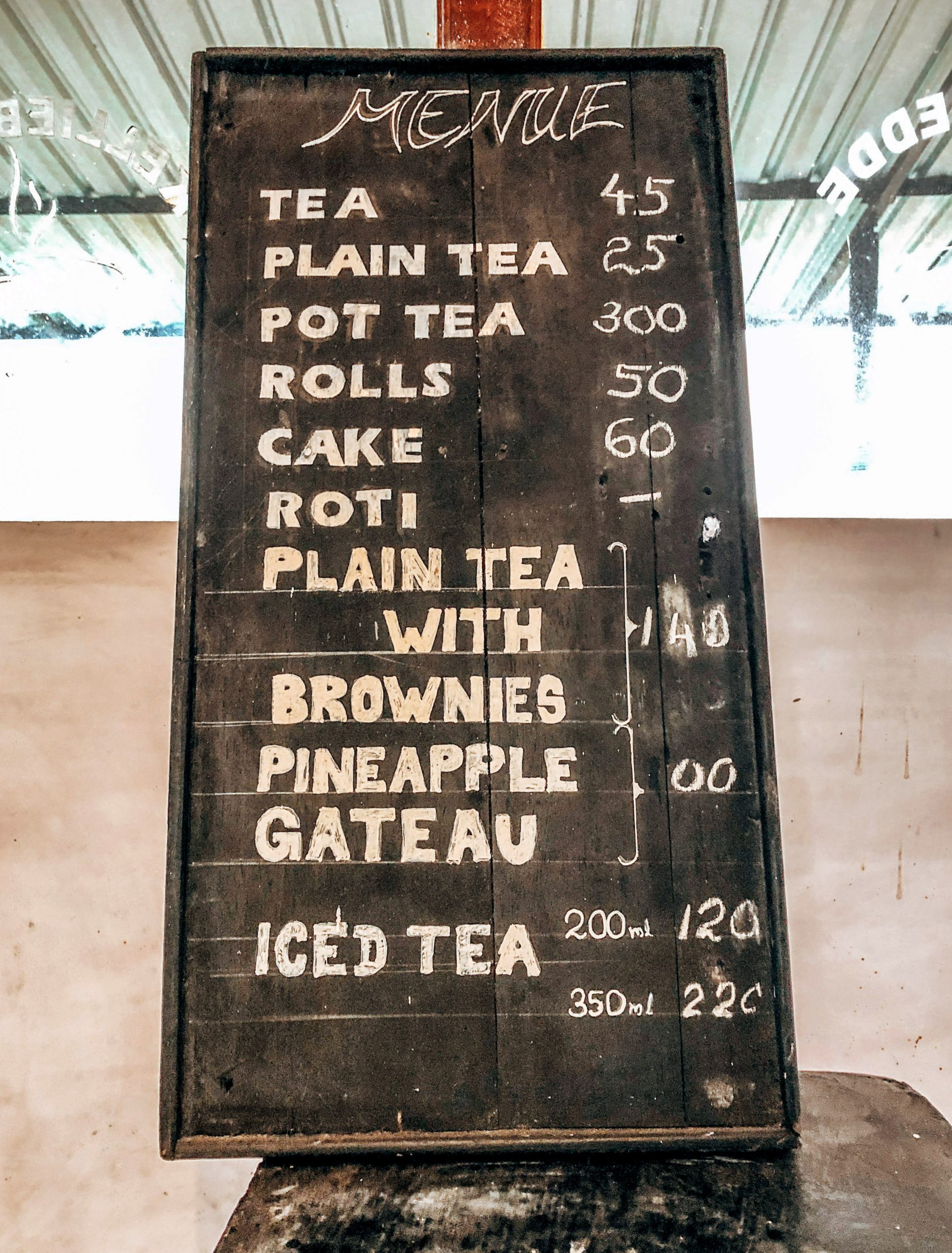 Tea menu written on a blackboard with white chalk