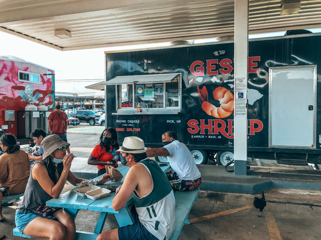 People enjoying outdoor seating at Geste Shrimp