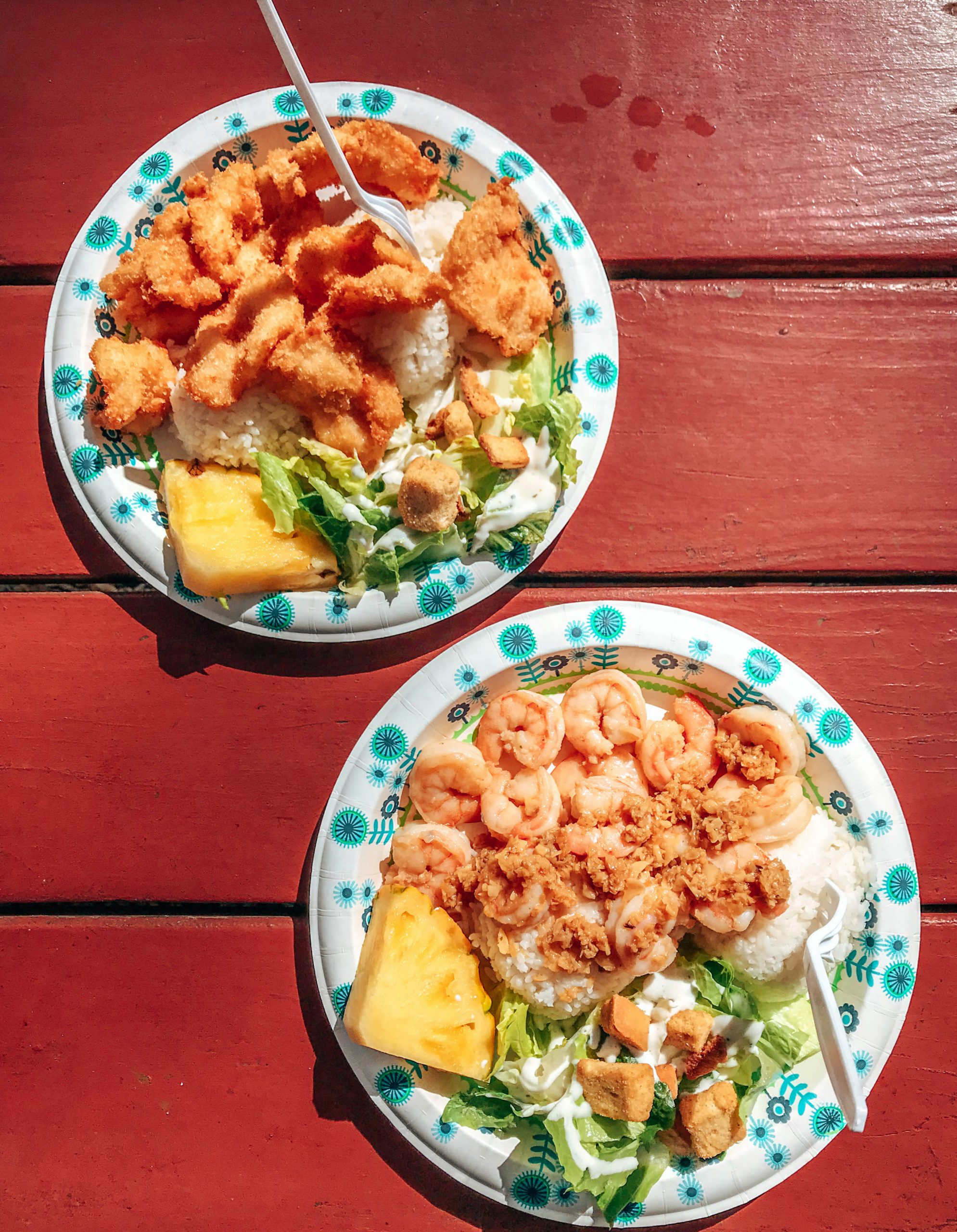 Two plates of mouthwatering shrimp shack delicacies